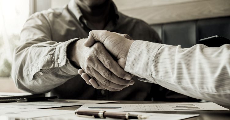 two people shaking hands